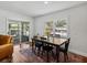 Dining room with wood table, black chairs, and sliding glass doors to the patio at 1144 Cephia St, Lake Wales, FL 33853
