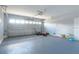 Spacious garage with large door, suitable for multiple vehicles and storage at 1144 Cephia St, Lake Wales, FL 33853