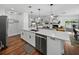 Modern kitchen with white cabinets, stainless steel appliances, and quartz countertops at 1144 Cephia St, Lake Wales, FL 33853