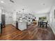 An inviting open concept living area that includes a modern kitchen, fireplace, and dining space, perfect for gatherings at 1144 Cephia St, Lake Wales, FL 33853