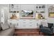 Bright living room featuring custom built-ins, offering stylish storage solutions and a modern entertainment setup for relaxation at 1144 Cephia St, Lake Wales, FL 33853