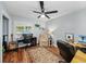 Inviting home office with wood floors, a ceiling fan, and multiple workspaces at 1144 Cephia St, Lake Wales, FL 33853