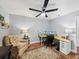 Spacious home office features wood floors, a ceiling fan, and two separate desk areas at 1144 Cephia St, Lake Wales, FL 33853