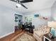 Well-lit home office with wood floors, a ceiling fan, and comfortable seating at 1144 Cephia St, Lake Wales, FL 33853