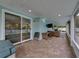 Spacious screened porch features a brick floor and multiple seating areas at 1144 Cephia St, Lake Wales, FL 33853
