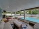 Screened in patio space offering comfortable seating and a pool view at 1144 Cephia St, Lake Wales, FL 33853