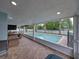 Screened porch offering views of the pool and backyard at 1144 Cephia St, Lake Wales, FL 33853