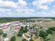 Aerial view with marker of home near greenery, businesses, and other neighborhood homes at 1351 Smokey Rd, Lake Wales, FL 33859