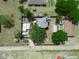 Aerial view of the property showcasing the layout, large backyard, and surrounding greenery at 1351 Smokey Rd, Lake Wales, FL 33859