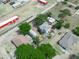 Birds eye view showcasing property's placement amongst lush trees and surrounding neighborhood at 1351 Smokey Rd, Lake Wales, FL 33859