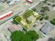 Aerial view of property showing layout, fencing, and home with lush surrounding trees on an expansive lot at 1351 Smokey Rd, Lake Wales, FL 33859