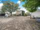 Expansive backyard with mature trees and landscaping, perfect for outdoor entertaining and relaxation at 1351 Smokey Rd, Lake Wales, FL 33859