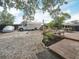Large backyard with mature trees, a deck, and ample space for parking or recreational activities at 1351 Smokey Rd, Lake Wales, FL 33859