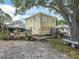 Lovely home featuring a spacious backyard with deck, seating and mature landscaping at 1351 Smokey Rd, Lake Wales, FL 33859