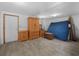 Unfinished basement featuring an armoire, vintage chest, and space for storage or customization at 1351 Smokey Rd, Lake Wales, FL 33859