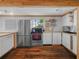 Bright kitchen featuring butcher block countertops, white cabinets and stainless appliances at 1351 Smokey Rd, Lake Wales, FL 33859