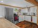 Bright kitchen featuring butcher block countertops, white cabinets and stainless appliances at 1351 Smokey Rd, Lake Wales, FL 33859