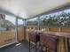 Enclosed patio featuring a live edge wood table with 2 cushioned stools and views of the yard at 1351 Smokey Rd, Lake Wales, FL 33859