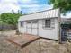 Well-maintained storage shed with a deck and windows, adding functional space to the property at 1351 Smokey Rd, Lake Wales, FL 33859