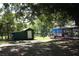 A storage shed and covered boat dock are set along the canal waterfront at 1422 Avenue H Sw, Winter Haven, FL 33880