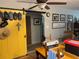 A dining room featuring a vibrant yellow door, unique decor, and a cozy eating space at 1422 Avenue H Sw, Winter Haven, FL 33880