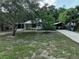 Charming home with a neatly maintained front yard and a covered carport for convenient parking at 1422 Avenue H Sw, Winter Haven, FL 33880