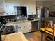 Well-equipped kitchen with stainless steel appliances, granite counters, and ample storage at 1422 Avenue H Sw, Winter Haven, FL 33880