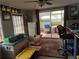 Sun room with storage, work space, and slider to outside, offering a bright flexible space at 1422 Avenue H Sw, Winter Haven, FL 33880