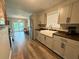 Stylish kitchen features wooden countertops and a farmhouse-style sink with stainless appliances at 1885 Pfundstein Rd, Babson Park, FL 33827