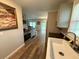 Bright kitchen featuring wood floors, modern appliances and ample storage space at 1885 Pfundstein Rd, Babson Park, FL 33827
