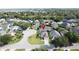 Picturesque residential neighborhood with mature trees, a golf course, and tranquil lake views at 2200 Mallory Cir, Haines City, FL 33844
