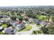 The residential neighborhood boasts mature trees, well-manicured lawns, and houses with screened-in pools at 2200 Mallory Cir, Haines City, FL 33844