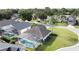 This aerial view captures the serene beauty of a residential neighborhood, filled with lush trees at 2200 Mallory Cir, Haines City, FL 33844