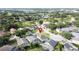 Serene residential neighborhood nestled among lush trees, with screened-in pools and manicured lawns at 2200 Mallory Cir, Haines City, FL 33844