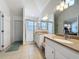 Spacious bathroom featuring granite counters, double vanity, and walk-in shower at 2200 Mallory Cir, Haines City, FL 33844