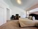 Bright bedroom with a cozy seating area, closet, and plenty of natural light at 2200 Mallory Cir, Haines City, FL 33844