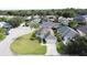 Well-maintained single-Gathering home with lush lawn and meticulously kept landscaping, offering great curb appeal at 2200 Mallory Cir, Haines City, FL 33844