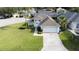 Charming single-story home with a manicured lawn, inviting entrance, and attached two-car garage at 2200 Mallory Cir, Haines City, FL 33844