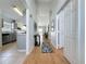 Spacious hallway with light walls, laminate flooring, and art for a clean and open feel at 2200 Mallory Cir, Haines City, FL 33844