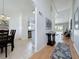 Spacious hallway with light walls, laminate flooring, and art for a clean and open feel at 2200 Mallory Cir, Haines City, FL 33844