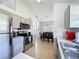 Kitchen showcasing stainless steel appliances and views into the dining area at 2200 Mallory Cir, Haines City, FL 33844