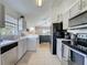 The kitchen offers updated appliances and a view into the main living area at 2200 Mallory Cir, Haines City, FL 33844