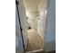 Well-lit bathroom features a shower with patterned curtains and neutral tile flooring at 2655 Swooping Sparrow Dr, Harmony, FL 34773