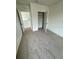 Bright, neutral carpeted bedroom with ample natural light at 2655 Swooping Sparrow Dr, Harmony, FL 34773