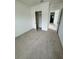 Unfurnished bedroom with neutral carpeting and an open closet at 2655 Swooping Sparrow Dr, Harmony, FL 34773