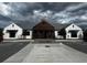 Modern clubhouse with a metal roof and dark wood accents at 2655 Swooping Sparrow Dr, Harmony, FL 34773