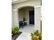 Charming front porch with a bench and decorative accents adding to the home's curb appeal at 2655 Swooping Sparrow Dr, Harmony, FL 34773