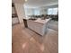 Open-concept kitchen with an island and a view of the living room at 2655 Swooping Sparrow Dr, Harmony, FL 34773