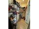 Walk-in pantry with tiled floor and wire shelving for easy storage and organization at 2655 Swooping Sparrow Dr, Harmony, FL 34773