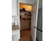 Walk-in pantry with tiled floor and ample shelving for organization and convenient storage at 2655 Swooping Sparrow Dr, Harmony, FL 34773